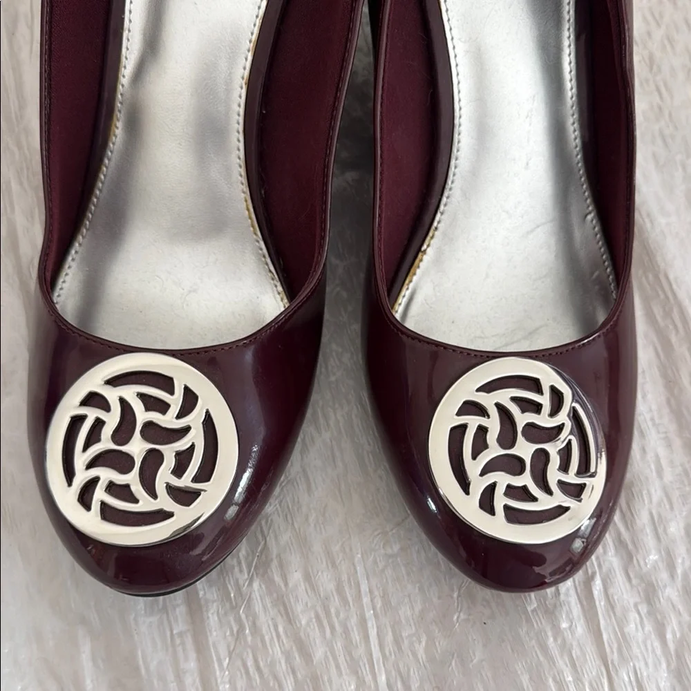 FIONI Clothing Burgundy Wedge Pumps with Silver Emblem
